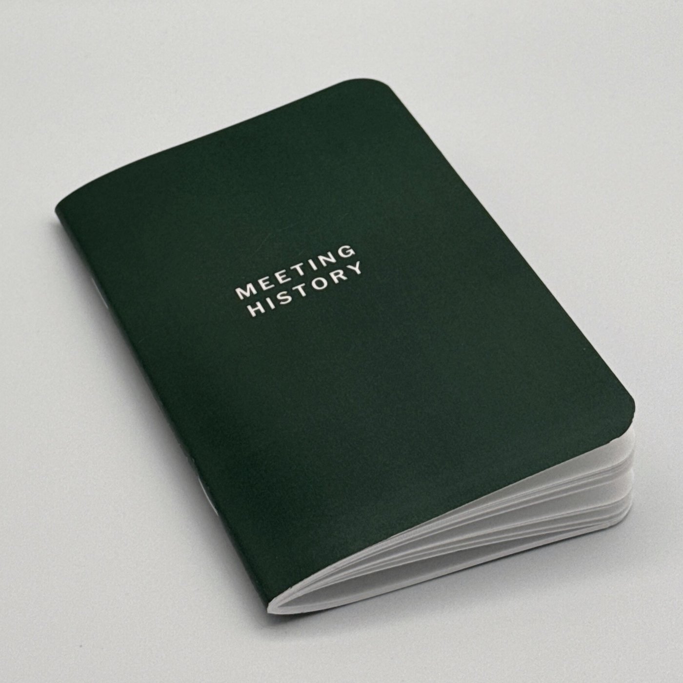 Meeting History booklet, front cover at an angle on a white background.