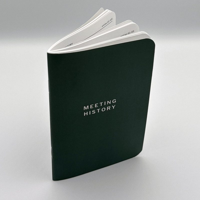 Booklet standing open with pages fanned.